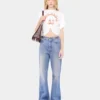 Flared jeans pyntet med 1969-skiver