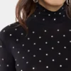 Sort top med krystalpynt i jersey, der sidder som et ekstra lag hud