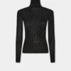 Turtleneck-top i uld, der sidder som et ekstra lag hud