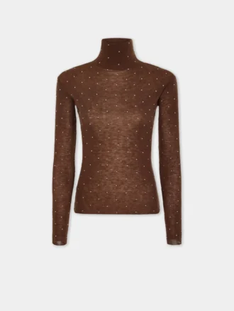 Turtleneck-top i uld, der sidder som et ekstra lag hud