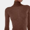 Turtleneck-top i uld, der sidder som et ekstra lag hud