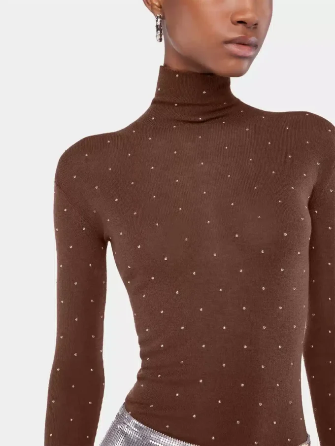 Turtleneck-top i uld, der sidder som et ekstra lag hud