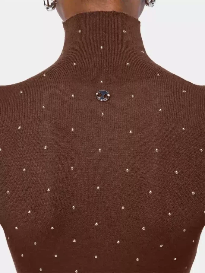 Turtleneck-top i uld, der sidder som et ekstra lag hud