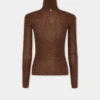 Turtleneck-top i uld, der sidder som et ekstra lag hud